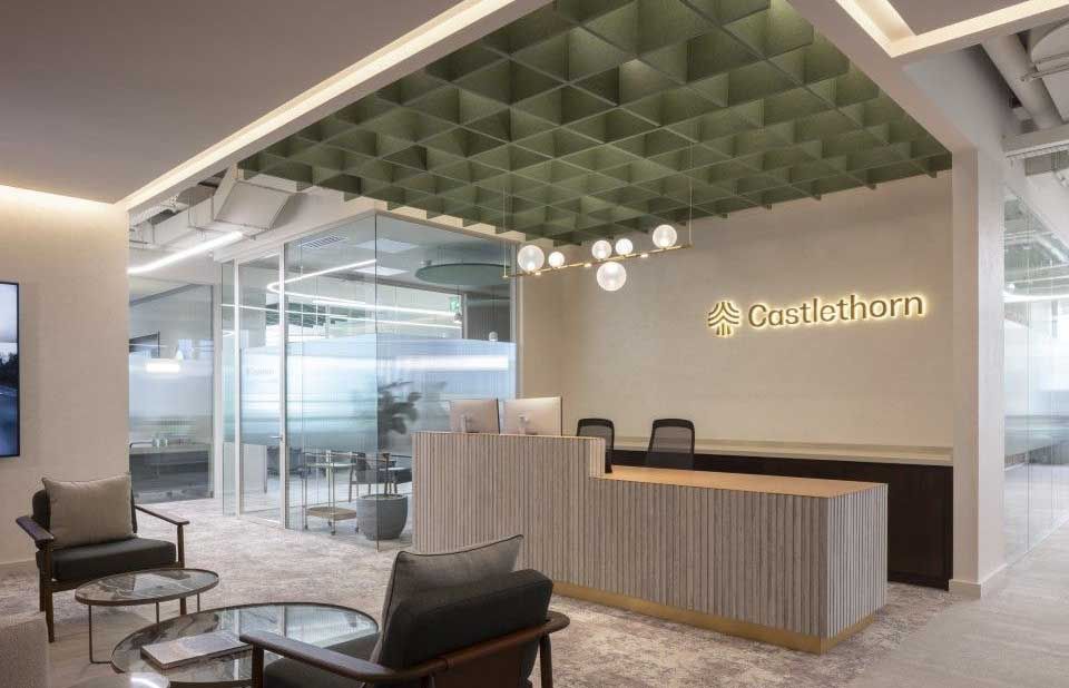 Castlethorn reception desk under a slatted ceiling feature